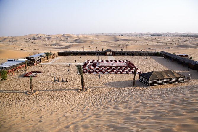 Abu Dhabi Desert Safari (Dune Bashing, BBQ Dinner, Camel Ride & Sand Skii) - A desert camp with food, henna, and shows