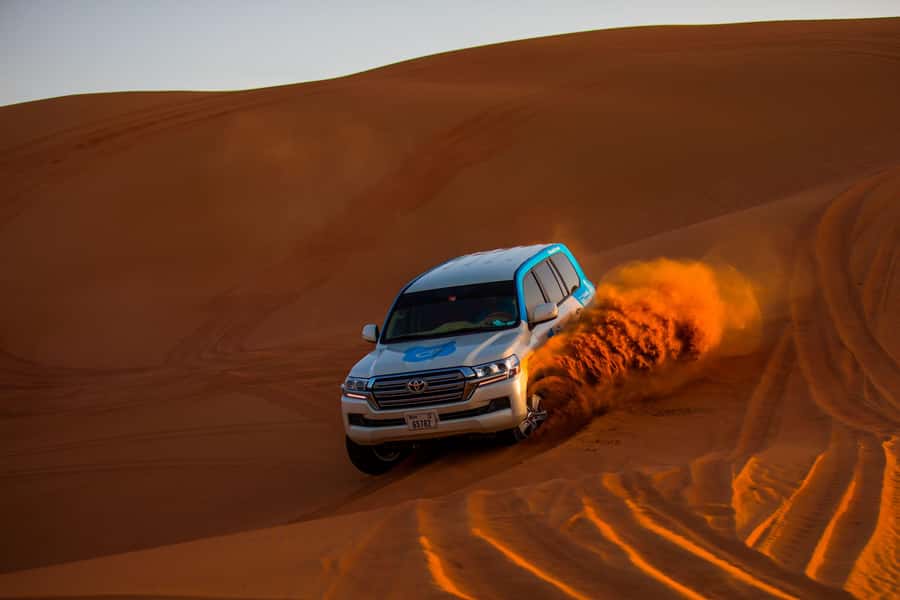 Abu Dhabi: Desert Safari, Quad Bike, Camels & Sandboarding - The camel ride keeps the experience grounded