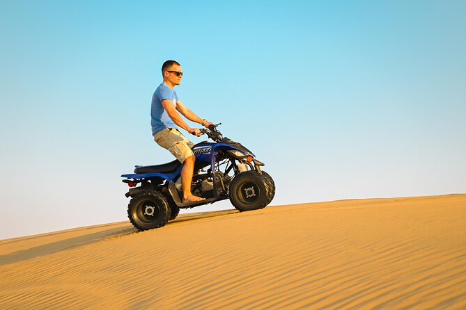 Abu Dhabi Evening Desert Safari - Dune bashing Camel ride and BBQ - Dune bashing in a Land Cruiser