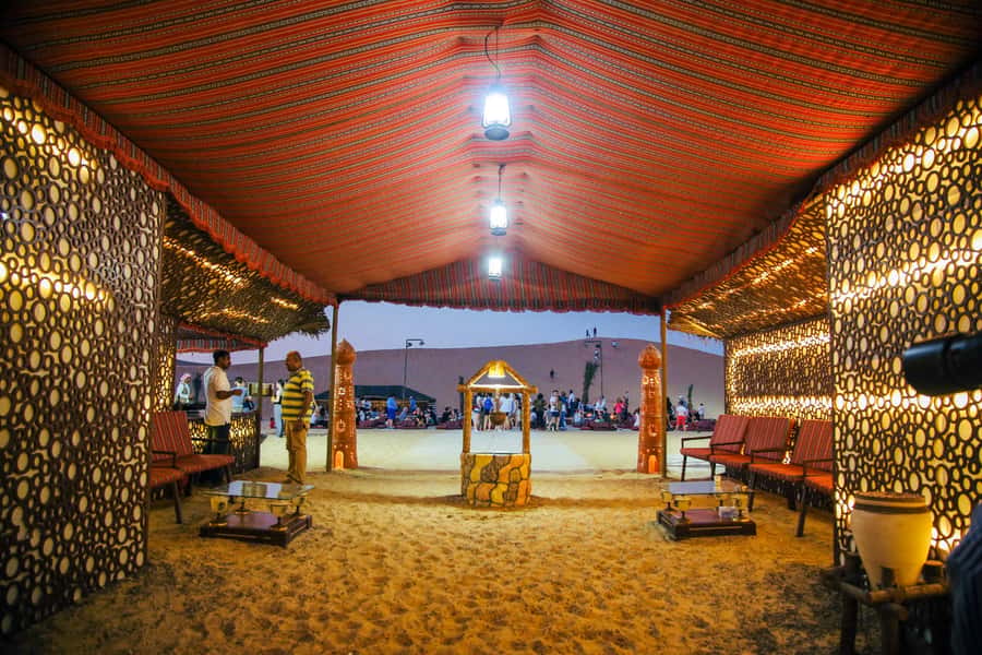 Abu Dhabi Traditional Desert Camp Experience And Quad Bike - Sunset, sandboarding, and the short quad bike ride