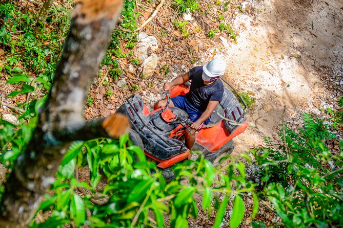Action-packed Cancun ATV tour, Ziplines, Cenote, Lunch and More - Swimming in a natural cenote