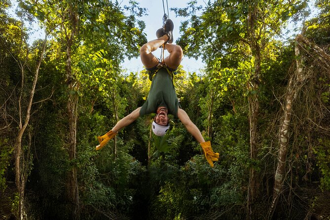 ATV Jungle Adventure with Ziplines, Cenote & Transportation - Crossing the three-zipline jungle circuit