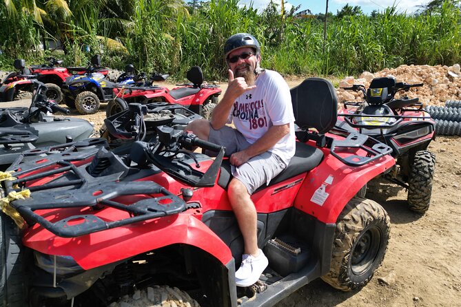ATV Jungle Ride, Zipline and Ricks Cafe from Montego Bay - ATV riding through wet trails and sugarcane fields