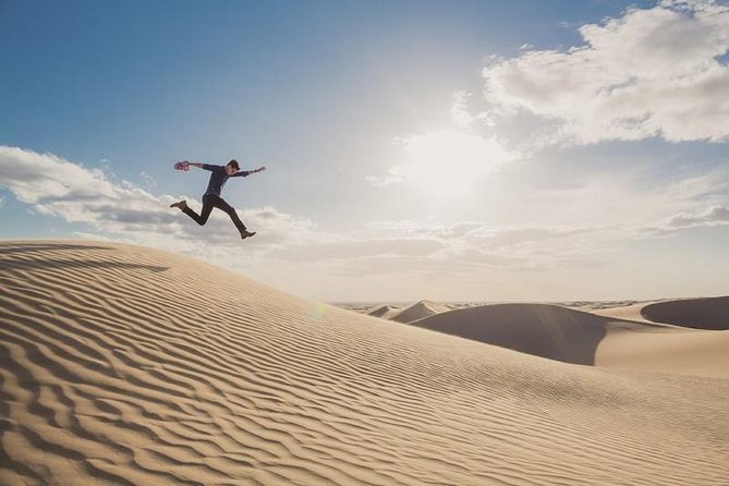 Desert safari, Dune bashing, sandboarding, camel, ATV Option - The Camel Stop Is Short but Photogenic