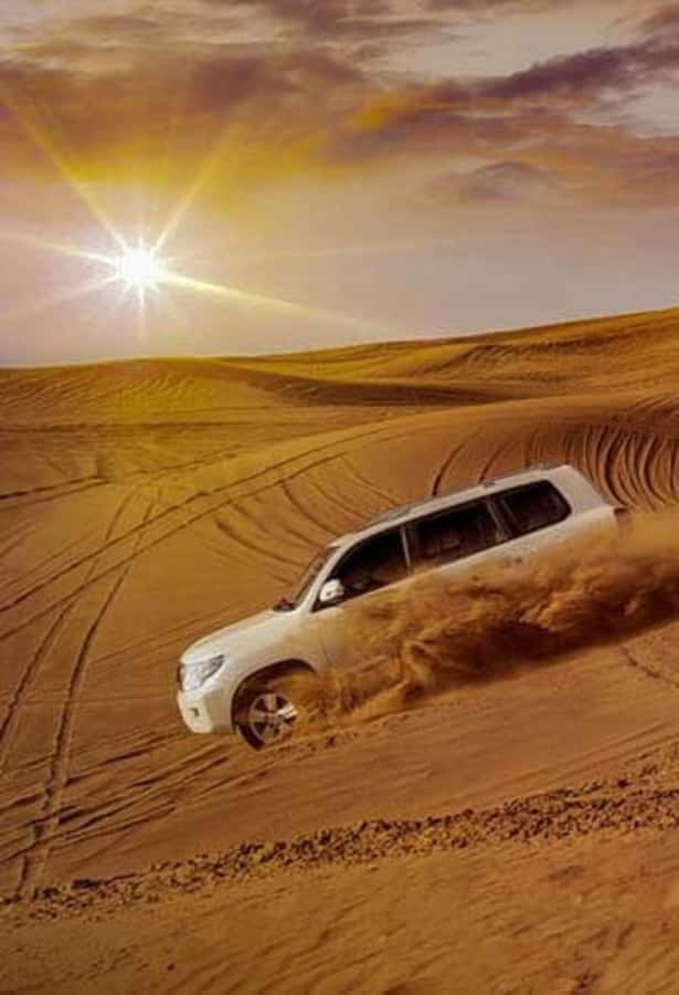 Desert Safari, Quad Bike, Camel Ride, Falcon & Sandboarding - Sandboarding from a high dune