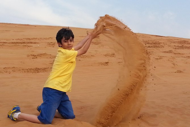 Desert Safari Tour, Quad Bike with BBQ Dinner & Show from Dubai - The camel ride is brief but still worth trying