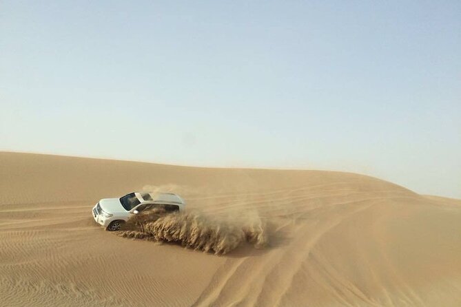 Doha Desert Safari Dune Bashing Camel Ride - Sandboarding with room to laugh at yourself