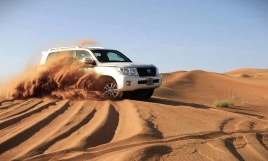 Doha: Desert Safari, Dune Bashing, Sandboarding, Camel Ride - Leaving Doha by air-conditioned Toyota
