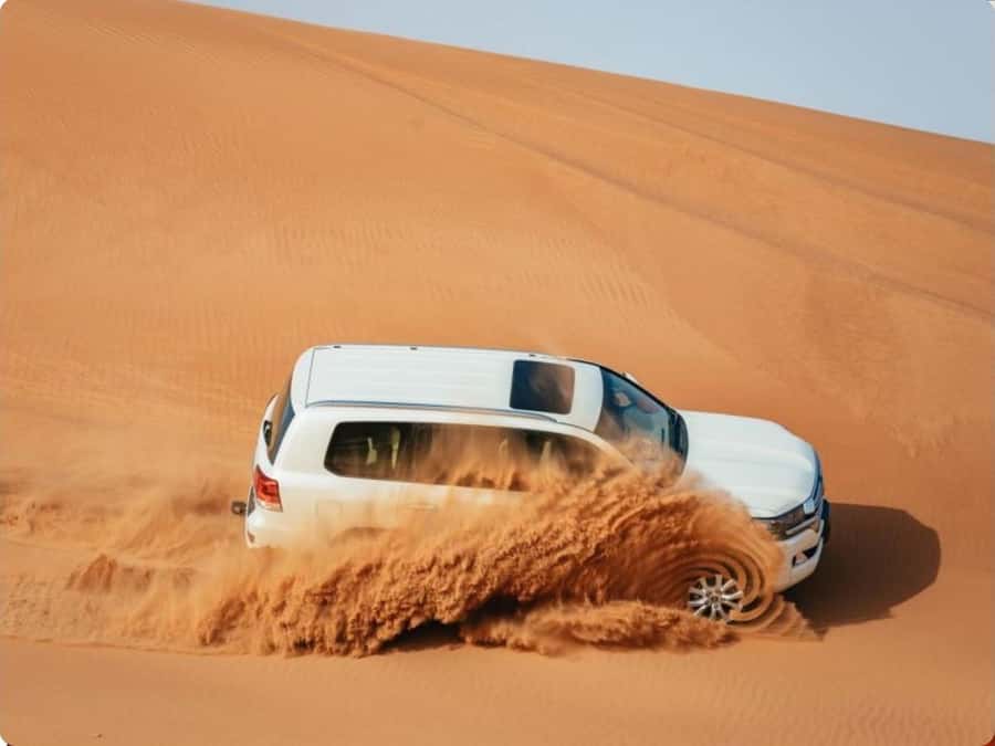 Doha:Desert Safari with Camel Ride, ATV Bike,& Sand Boarding - From Doha to Qatar’s inland desert