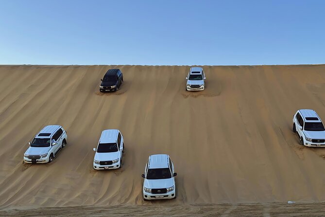 Doha: Luxury Desert Safari, Quad Bike & Sandboarding - Leaving Doha in an air-conditioned 4x4
