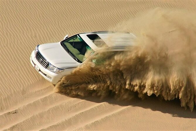 Doha: Quad Bike, Dune Bashing, Camel Ride & Inland Sea Tour - Quad biking at Mesaieed
