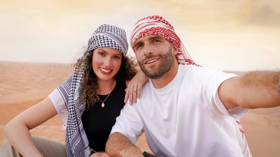 Dubai Desert Adventure: Red Dunes Guided Quad/Polaris & BBQ - Sandboarding and the desert sunset