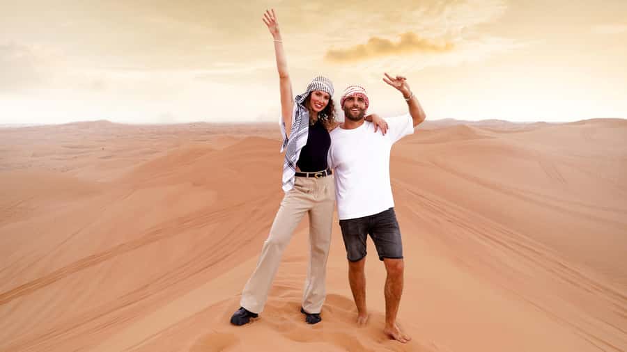 Dubai Desert Adventure: Red Dunes Guided Quad/Polaris & BBQ - A short camel ride and Bedouin-style welcome