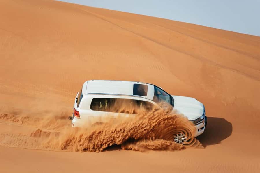 Dubai: Desert Safari, Camel Ride, Sandboarding, Quad Bike - From Dubai towers to the Red Dunes