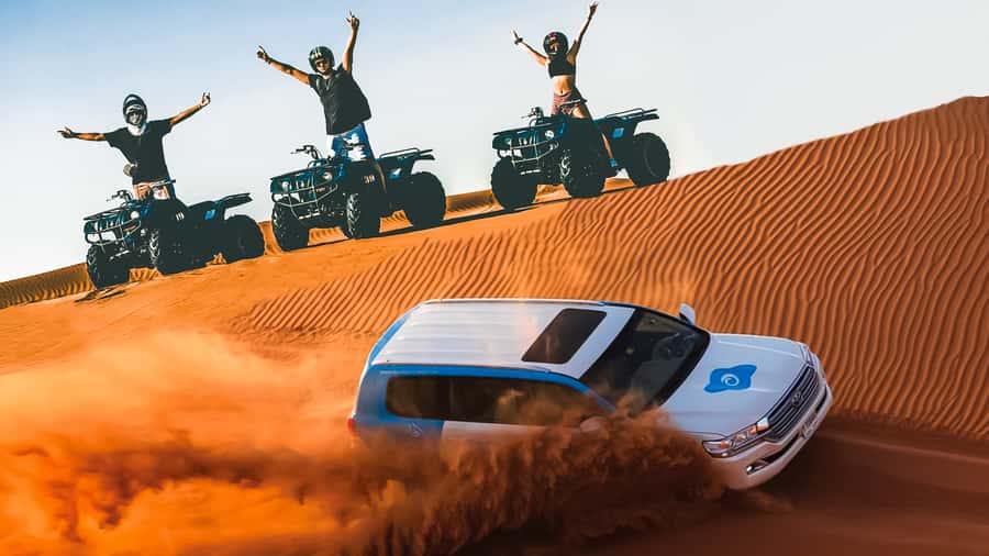Dubai: Desert Safari, Quad Bike, Camel Ride & Al Khayma Camp - Dune bashing across the Red Dunes