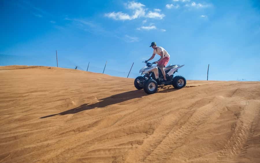 Dubai: Desert Safari, Quad Bike, Camel Ride and Sandboarding - Optional quad biking adds speed, but also responsibility