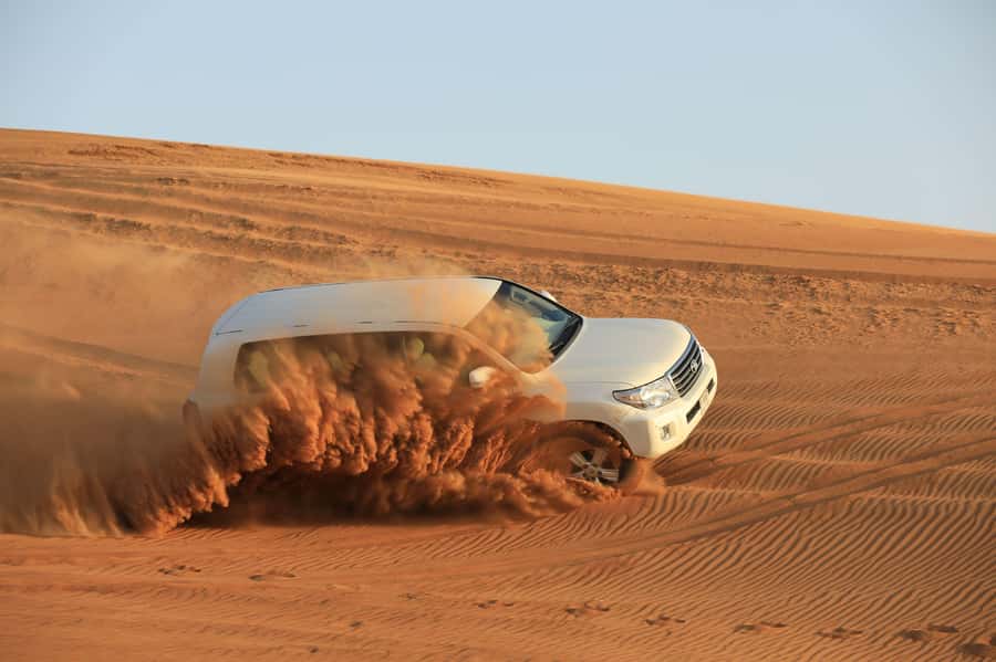 Dubai: Desert Safari, Quad Bike, Sandboarding, Camels & BBQ - Arabic coffee, dates, and the shared camp