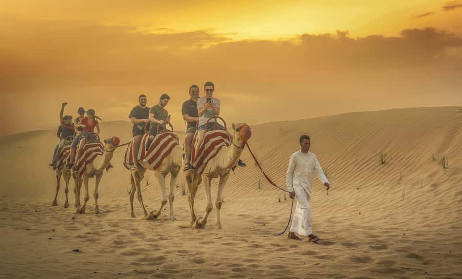 Dubai: Desert Safari, Quad Bike, Sandboarding, Camels & BBQ - Dune bashing across the red sand