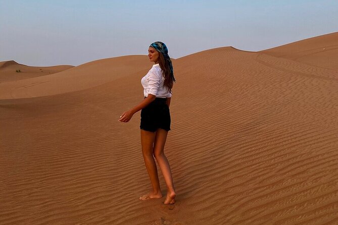 Dubai Desert Safari: Tanoura Show, Dune Bashing and BBQ Dinner - Sandboarding gives the dunes a second purpose