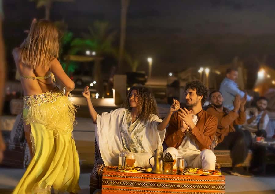 Dubai: Desert Safari with BBQ Dinner & Quad Biking Option - Red dunes, sunset light, and a rough 4x4 ride