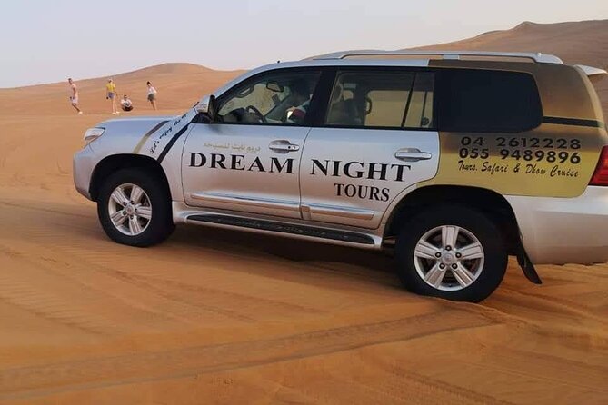 Dubai Desert Safari with Dune Bashing, Camel Ride, & BBQ Dinner - The Bedouin-style camp after sunset