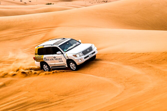 Dubai Desert Safari with Dune Bashing, Camel Ride, & BBQ Dinner - BBQ dinner, drinks, and the evening shows