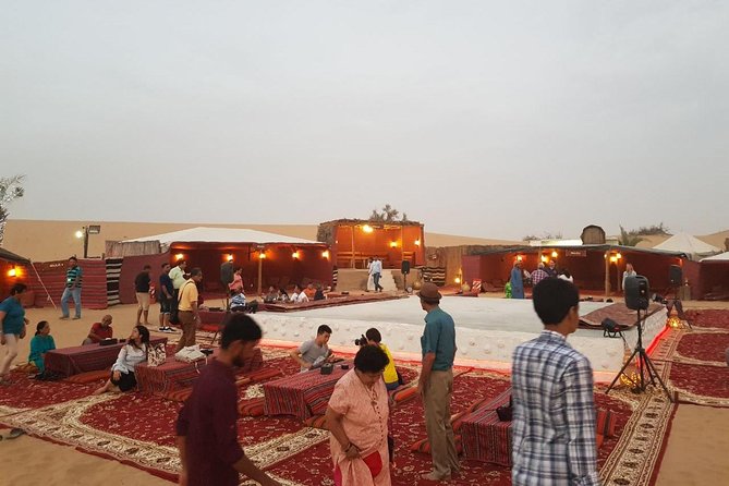 Dubai Desert Safari with Quad Bike, sandboarding, live show & BBQ - Camel riding and the camp welcome