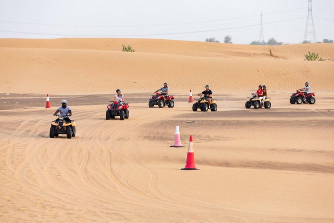 Dubai Desert Safari with Quads, BBQ Dinner, Camel ride, & Shows - Camel ride and traditional camp activities