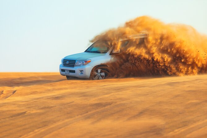 Dubai Evening Desert Safari With Transfers Dune Bashing & Dinner - Dune bashing and the best sunset photos