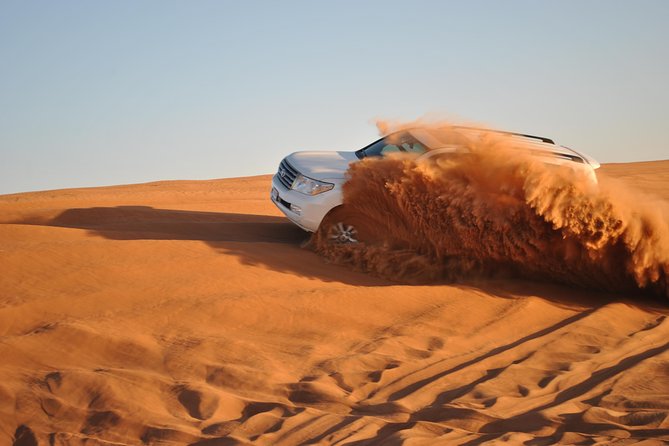Dubai: Jeep Desert Safari, Camel Ride, and Quad Bike Tour - Pickup, timing, and the guide experience