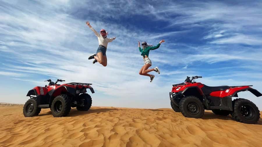Dubai: Quad & ATV Bike, Red Dune Desert and Safari Adventure - Riding Dubai’s red dunes by quad bike
