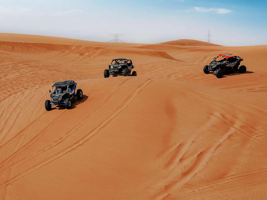 Dubai: Quad Bike or Dune Buggy Adventure & Optional Transfer - Sandboarding adds a second way to use the dunes
