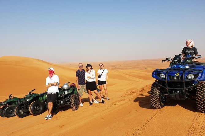 Dubai: Quad Bike Safari, Camels, & Camp with BBQ Dinner - A Bedouin-style camp after sunset