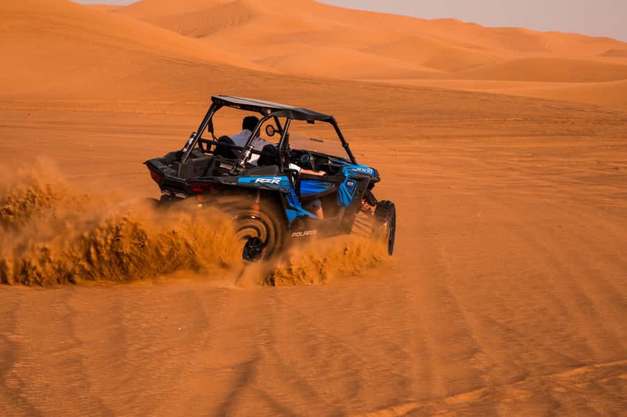 Dubai: Red Dune Desert Safari, Quad Bike, Camels, and BBQ - Sandboarding on a steep dune