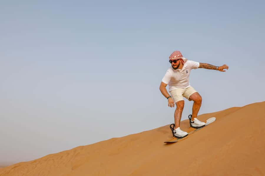 Dubai: Red Dunes Quad Bike with Sandboarding, Camels and BBQ - One hour on a self-drive quad bike