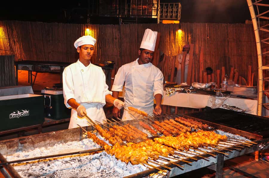 Dubai: Safari, Quad Bike, Camel Ride, and Buffet Dinner - Dune bashing across the red sand