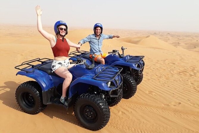 Dubai Self-drive Quad Bike, Sand Boarding, Camels & Refreshments - Sandboarding on the same stretch of dunes