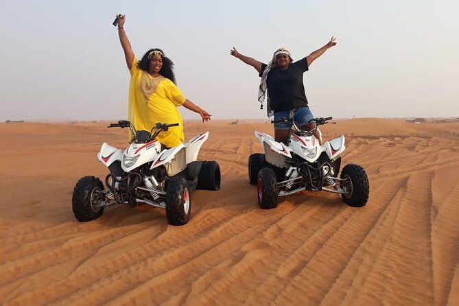 Evening Red Dunes Safari with Quad Biking, BBQ Dinner & LiveShows - Quad biking across Lahbab’s red sand