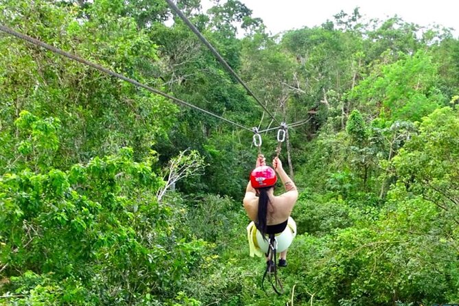Family ATV Cenote Five Zip Lines Photos Taco Lunch Tequila Taste - Riding the ATV through the jungle