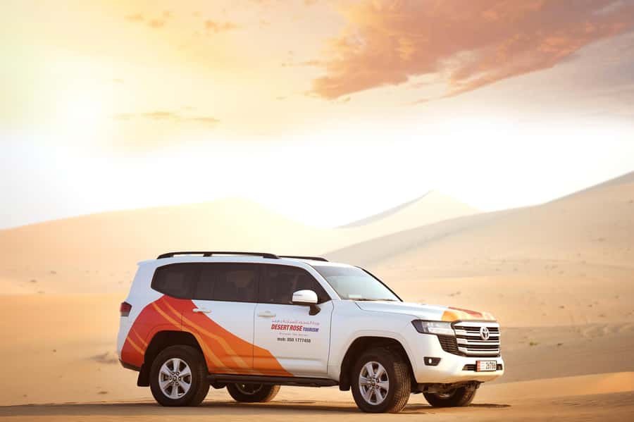 From Abu Dhabi: Dune Bashing Desert Safari - Sandboarding and optional quad bikes