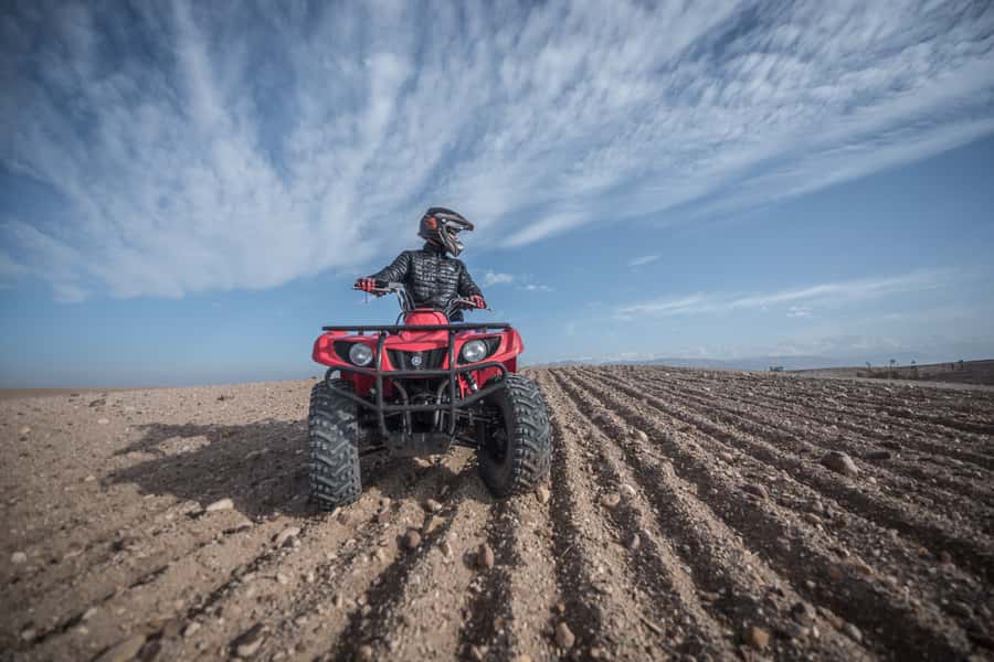 From Marrakech: Premium Agafay Desert Half-Day Quad Biking - Riding through dry rivers and rocky hills