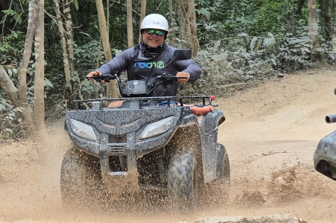 Jade Caverns and Mayan Village Cozumel ATV TOUR - Riding the ATV through dirt, rocks, and mud