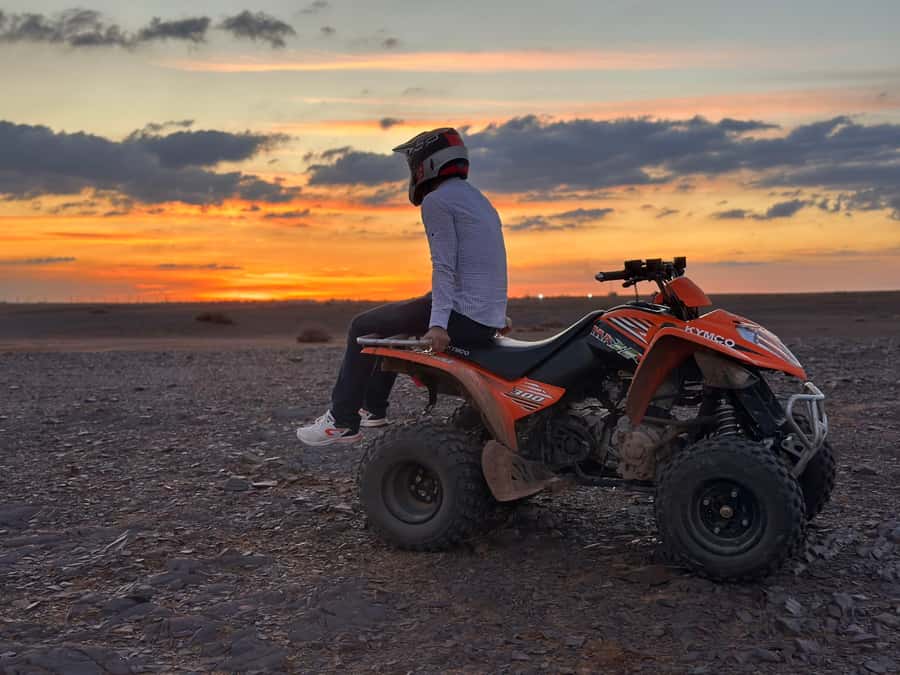 Marrakech: Desert and Palm Grove Sunset Quad Tour with Tea - Riding through palms, hills, and rocky desert
