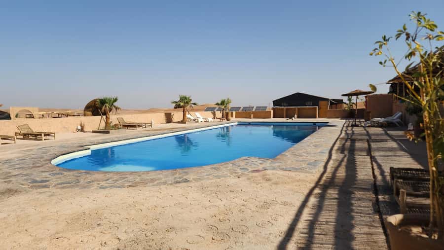 Marrakech Desert Sunset: Quad Biking, Dinner & Fire Show - A pool break with a practical warning