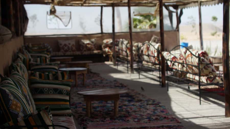 Marrakech Desert Sunset: Quad Biking, Dinner & Fire Show - Moroccan dinner under the evening sky