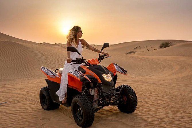 Morning Desert Safari with Quad Bike, Camel Ride & Sandboarding - Sandboarding with a guide