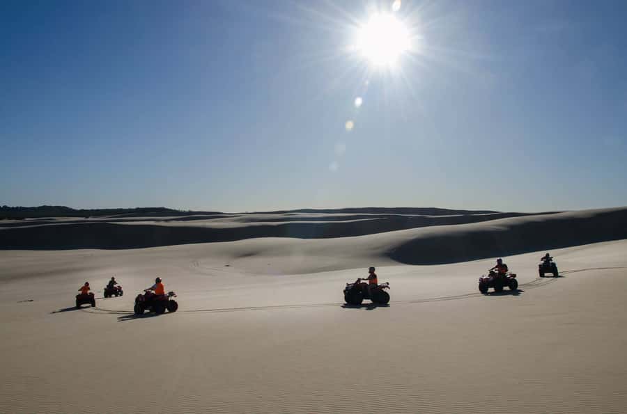 Port Stephens: Worimi Sand Dune Quad Bike Adventure - Building speed across the coastal grasslands
