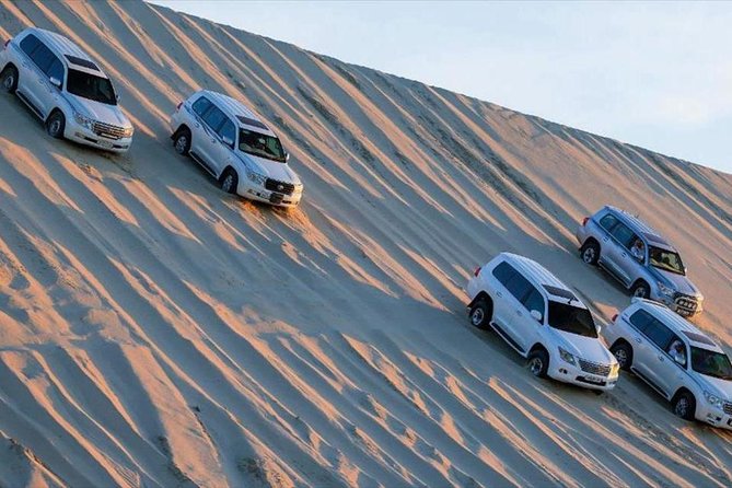 Premium Full-Day Safari, Dune Bash, Camel Ride and BBQ Meal in Desert Camp - A shared camp, BBQ meal, and time to swim