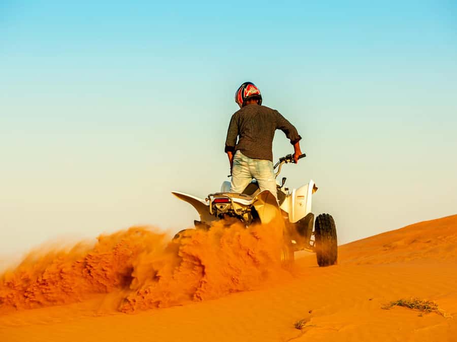 Ras Al Khaimah: Guided Quad Bike Tour - Riding into Ras Al Khaimah’s red dunes