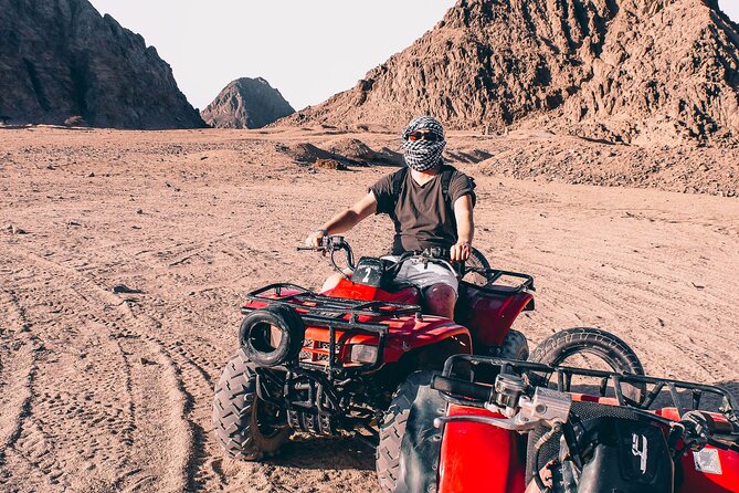 Sharm: Quad Bike or Car Buggy, Camel ride & optional VIP Bedouin Dinner & Show - Pickup from your hotel and the road to the safari area